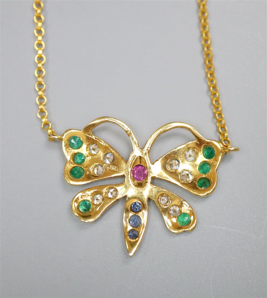 A modern 9ct gold, ruby, emerald, sapphire and diamond set butterfly pendant necklace, 45cm, gross 2.8 grams.